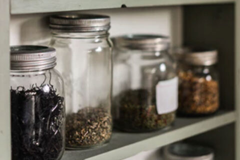 Glass jars are stored in kitchen space
