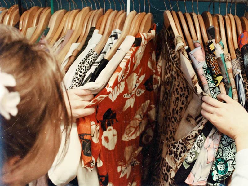 Women Selecting clothes from the closet